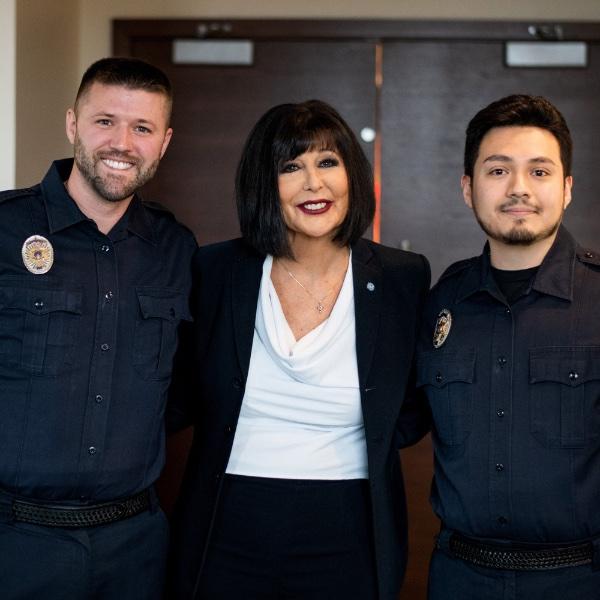 New GVPD officers pose alongside President Mantella