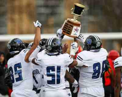 Grand Valley players hold up the Anchor-Bone Classic trophy after beating Ferris State last season.