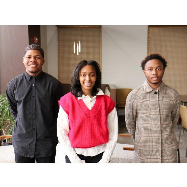 Three students standing in office setting, from left, Kamarion Craig, Nadia Miller and Darian Quinn